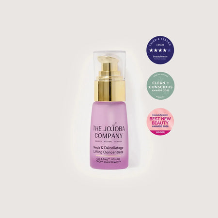 Purple skincare bottle with gold pump on a white background, featuring awards and badges.