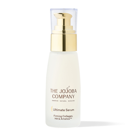 Bottle of 'The Jojoba Company' Ultimate Serum with pump dispenser against a white background.